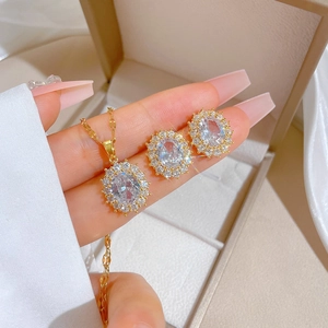 Detailed view of luxury oval-cut zircon necklace and earrings set in a gift box