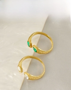 Detail of 18K gold-plated stainless steel ring with textured band and teardrop zircons