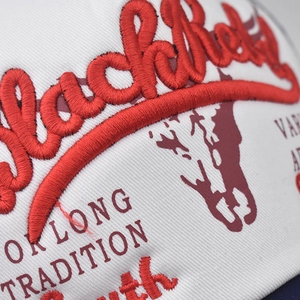 Close-up of red 3D embroidery on washed cotton vintage baseball cap with Blackhey text