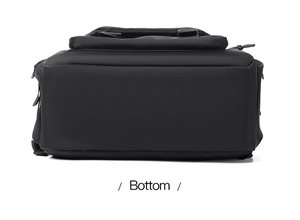 Detailed bottom view of black backpack showing reinforced wear-resistant material padding