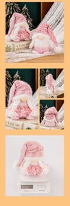 Detail of pink Christmas gnome plush with sequin knit hat and braided hair decoration