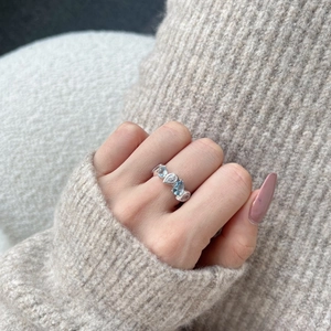 Elegant S925 silver ring featuring blue water drop zircon stones worn on model hand