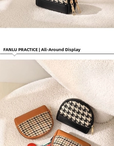 Close-up of houndstooth mini coin purses with zipper detail on white plush background