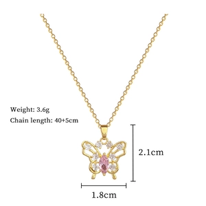 Detail of gold butterfly necklace with pink stone, 40+5cm chain length and 3.6g weight