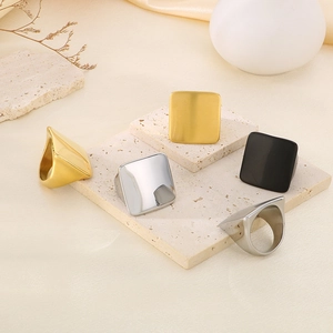 Detailed set of thick square titanium rings in gold, silver, and black matte finishes