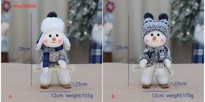 Detail of luxury blue snowman plush dolls with skis and winter accessories for Christmas decor