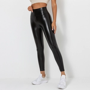 Detail showing high-waisted black PU leather leggings with a glossy shine and slim fit