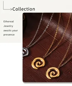 Detailed view of swirling metal pendants in gold and silver finish with polished textures