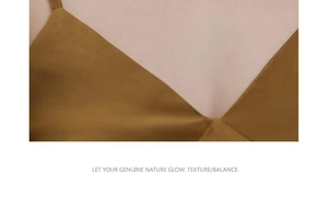 Detailed view of the V-neckline on a premium brown silk-like fabric garment