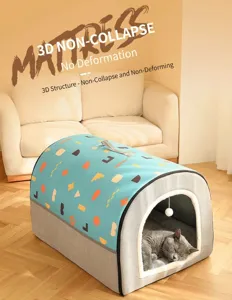 Detail of Shiba Inu sleeping in a warm semi-enclosed pet bed with plush hanging ball