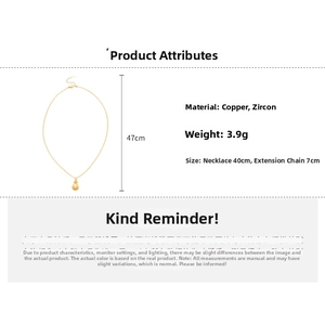 Detail view of gold necklace showing dimensions 40cm plus 7cm with copper and zircon specs