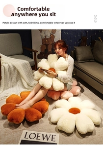 Close-up of petal-shaped plush cushions in cream, orange, and pink for sofa decor