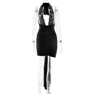 Back view of black halter dress featuring open back design and ruching detail