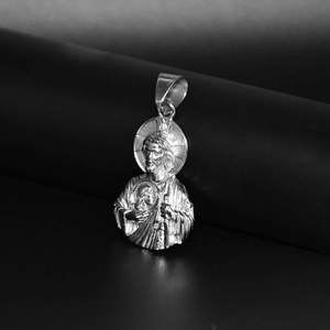 Silver 316L stainless steel Saint Jude pendant with polished metallic finish on black background