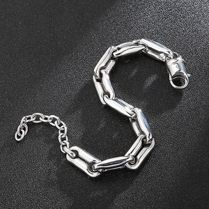 Macro view of silver stainless steel thick chain bracelet with lobster clasp and extender