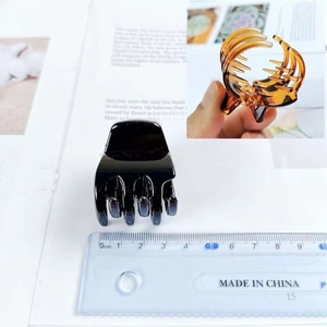 3.5cm square hair claw clip in glossy black and amber finish showing size measurement