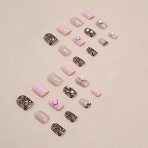 Pink heart and tiger print press-on nails with glitter accents and 3D pearls