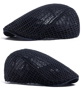 Detail of black mesh beret showing breathable woven texture and classic flat cap design