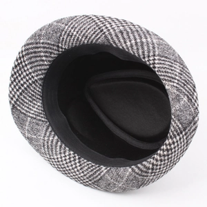 Classic black and white houndstooth fedora hat with soft lining in a top-down view