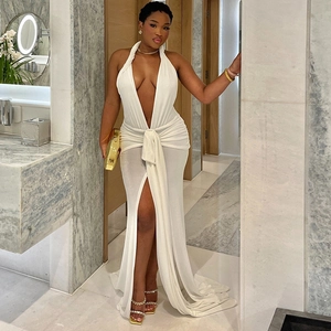 Elegant white halter neck backless maxi dress with deep V-neck and high side split design