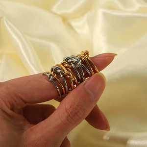 Minimalist knotted stainless steel rings in gold and silver finish for women