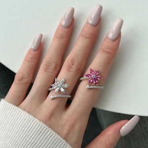 Detailed shot of S925 silver adjustable rings with pink and white flower-shaped gemstones