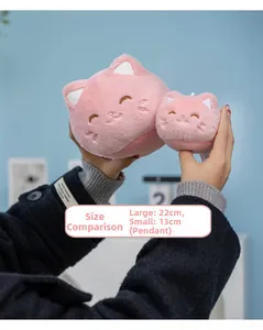 Size comparison between 22cm plush cat toy and 13cm small cat keychain accessory