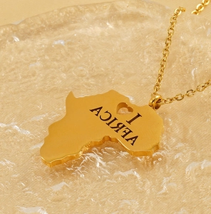 Detailed view of a gold Africa map pendant with I Love Africa engraving on water texture
