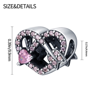 Detail of silver heart charm with pink cubic zirconia and clear size measurements
