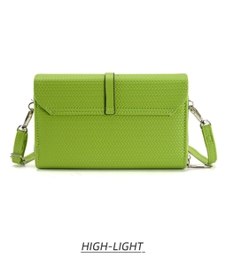 Detail of green woven texture and silver metal hook on stylish crossbody phone bag