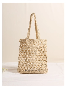 Close-up of beige straw shoulder bag showing hollow mesh weaving and breathable texture