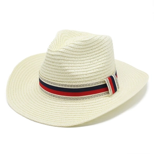 Detail of woven straw hat featuring a red and blue striped band with Greek key pattern