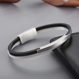 Detail of silver mesh and black leather cord bracelet with rectangle magnetic clasp