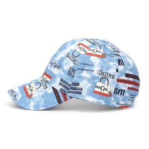 Detail of blue and white tie-dye cotton baseball cap with graffiti and letters