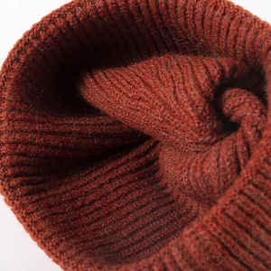 Classic ribbed knit beanie in caramel rust color with thick premium wool texture