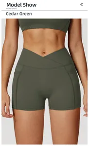 Detail view of high waist yoga shorts featuring V-cross waistband and side pockets