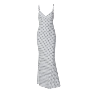 Detail of white polka dot dress featuring slim fit long cut and delicate thin straps