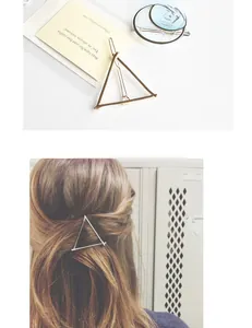 Minimalist gold triangle and silver crescent alloy hair clips worn on styled hair