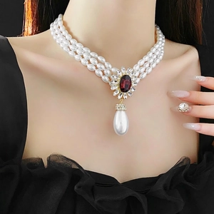 Three-layer pearl necklace with a vintage oval gemstone and water drop pearl pendant