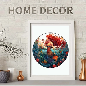 Artistic mermaid wall decor with red hair in a white round frame on a minimalist background