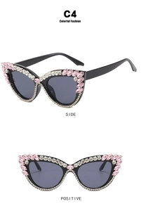 Detail view of cat eye sunglasses with C4 black frames and colorful rhinestone accents
