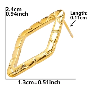Detail view of gold rhombus earrings with bamboo texture and size measurements
