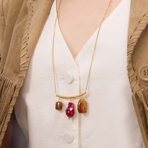 Vintage gold stainless steel necklace with resin charms on a model in bohemian style