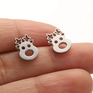 Detail view of moose stud earrings in matte silver steel with star deer antlers