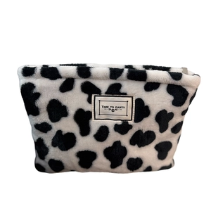Cute plush cow print coin purse with Time to Party tag on white background