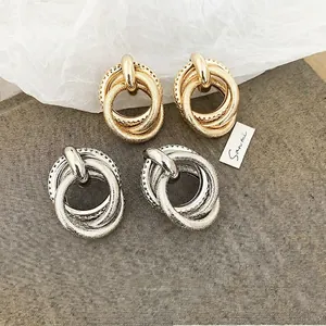 Minimalist layered irregular round metal stud earrings in gold and silver finish