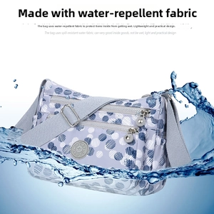 Waterproof detail of light purple polka dot nylon crossbody bag with splash effect