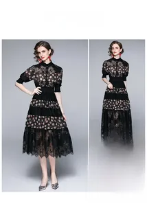 Detail of black mesh lace dress featuring polka dot patterns and eyelash lace trim