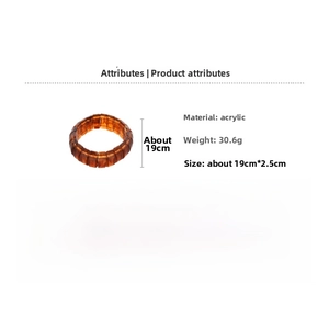 Macro detail of amber resin elastic bracelet showing acrylic texture and 30.6g weight info