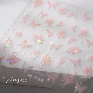 Macro shot of M-726 holographic nail stickers featuring pink butterflies and floral designs